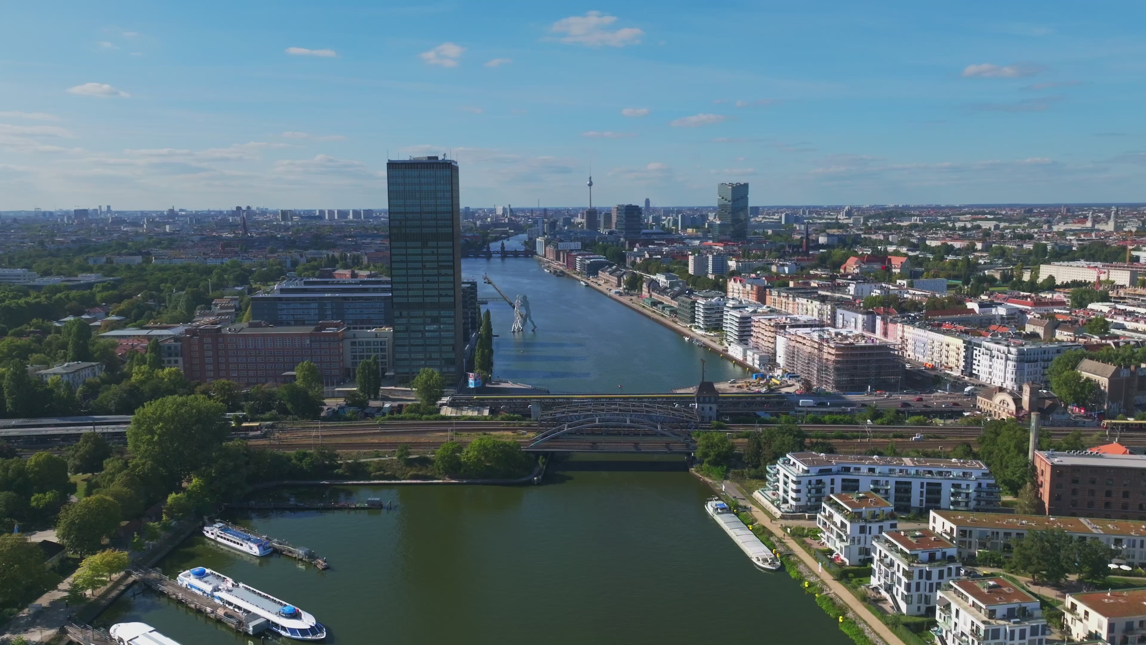 Aerial view of the Spree River with Molecule Man sculpture in Berlin, Germany.