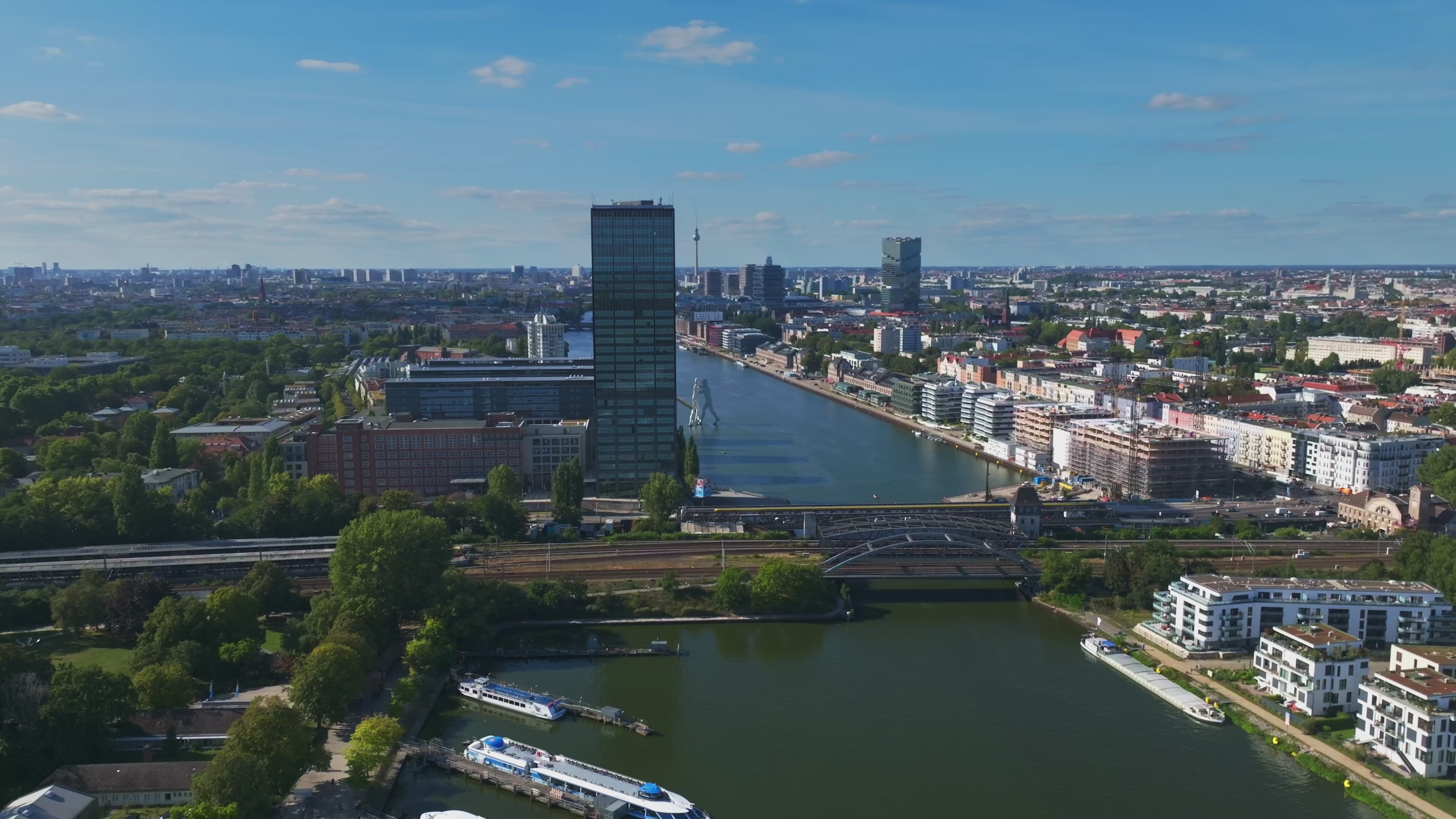 Aerial view of the Spree River with Molecule Man sculpture in Berlin, Germany.