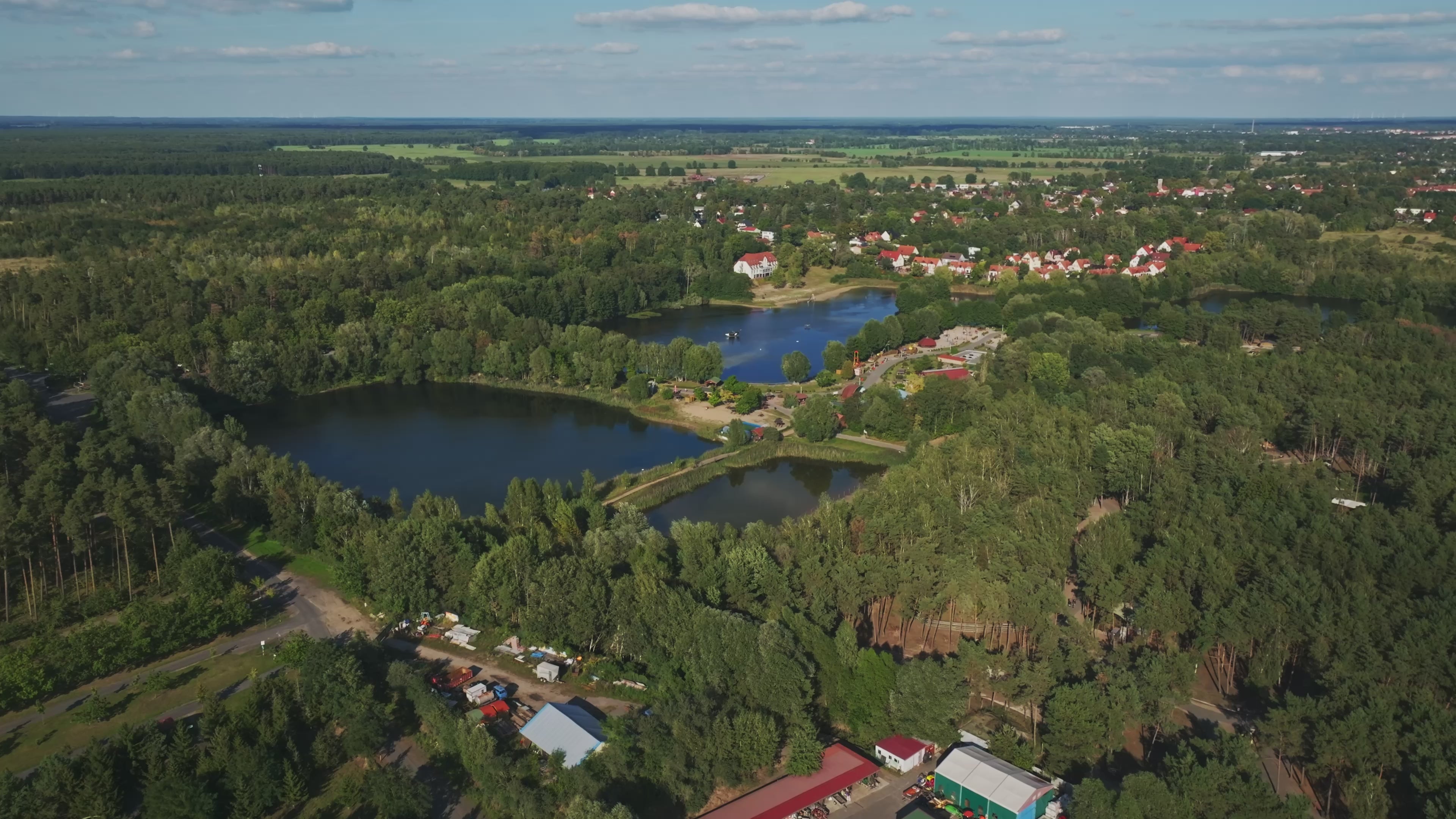 Aerial drone view of Germendorfer Waldsee lake in Oranienburg, Germany.